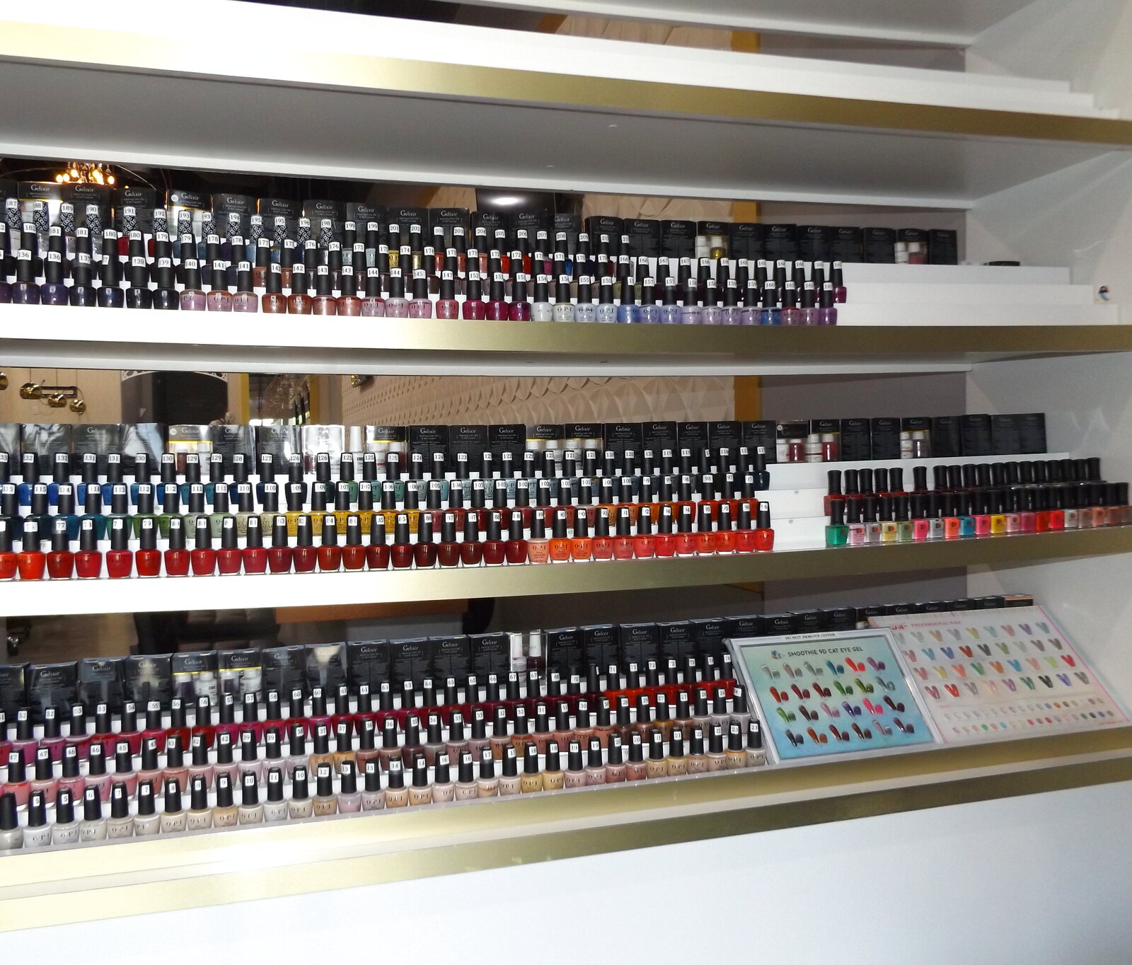 Wall of colorful nail polish at Blossom's Nails Boutique
